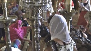 Pilgrim touching stone of anointing, Church of the Holy Sepulcher
